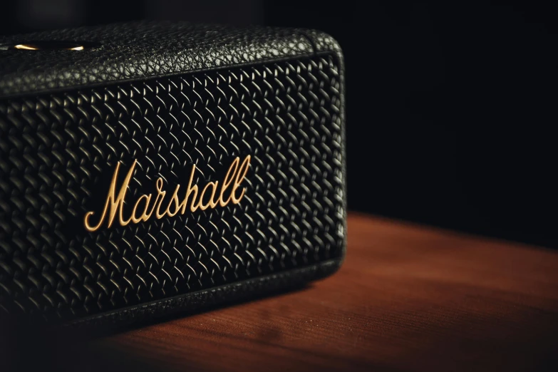 close up of marshall amps in front of a wooden surface