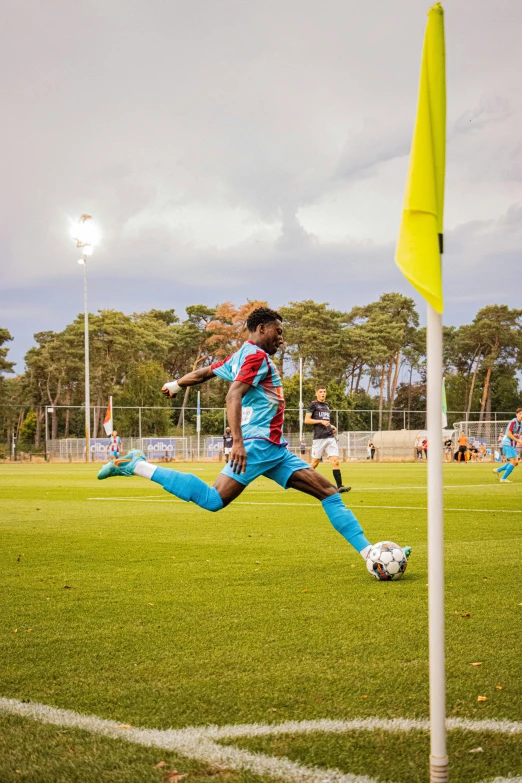 the soccer player is going after the ball in the air