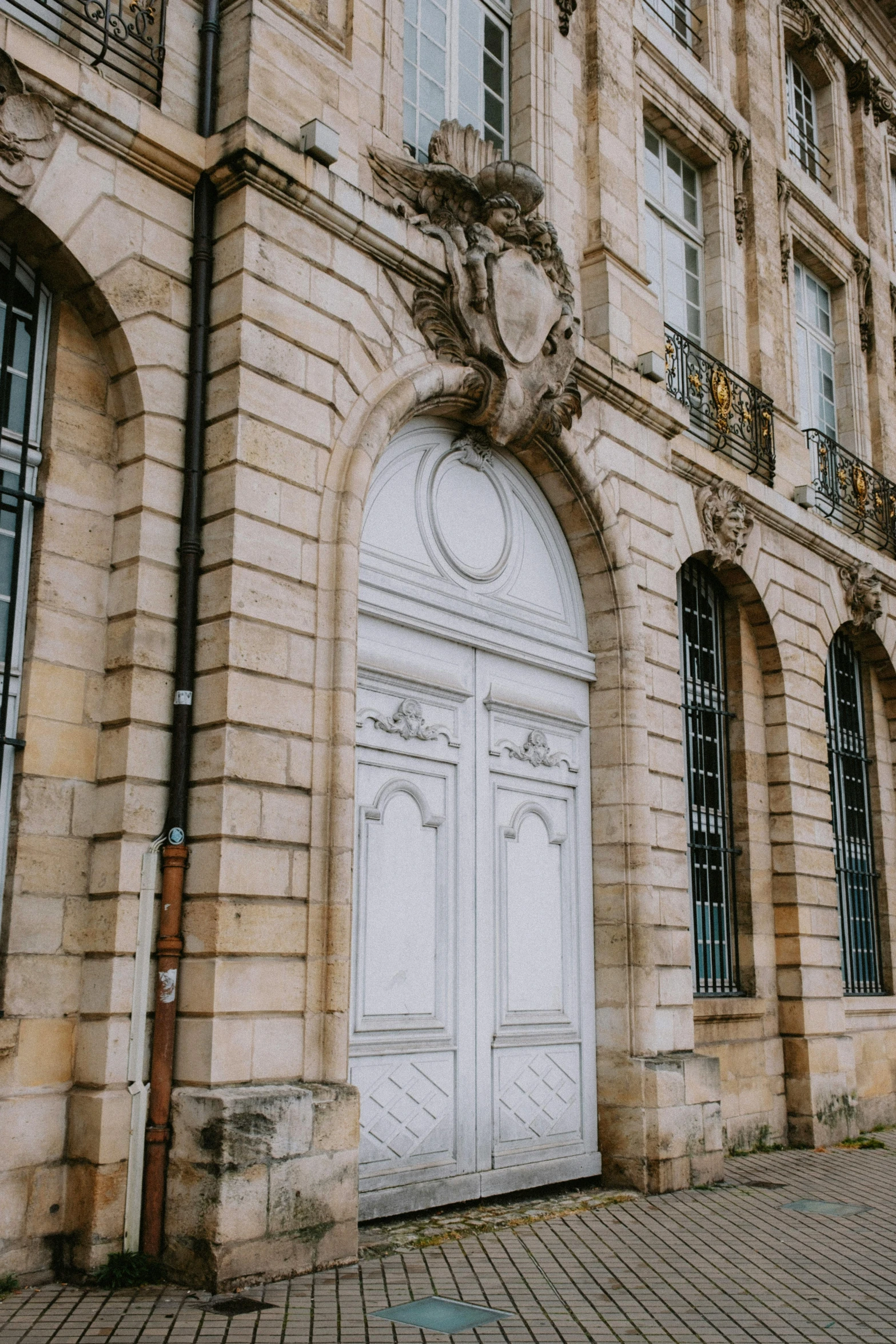 the large building has many windows and a carved doorway