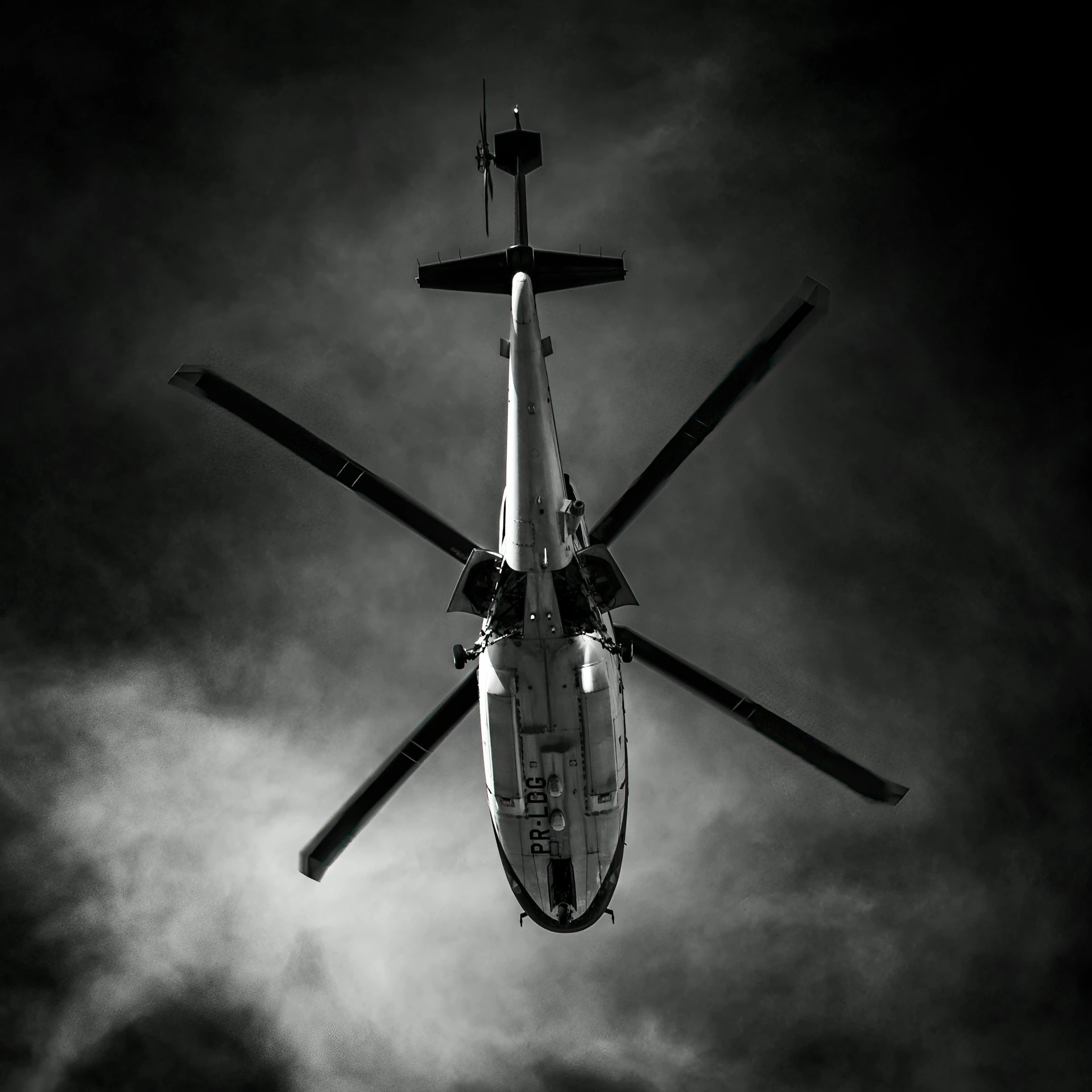 a white and black helicopter is flying in the air