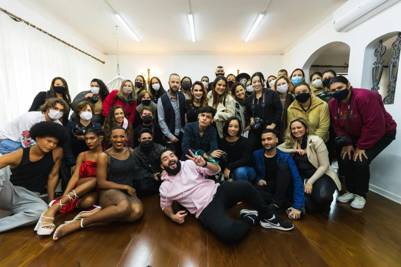 a group of people posing in a room