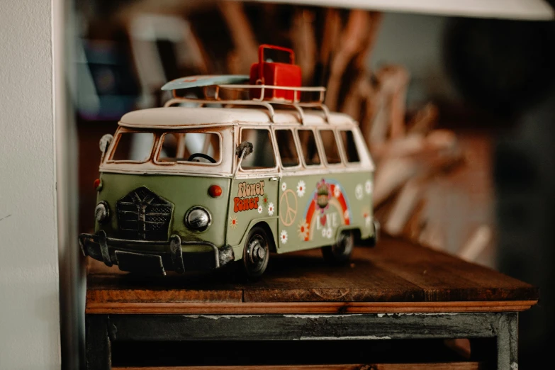 a toy van on top of a wooden table