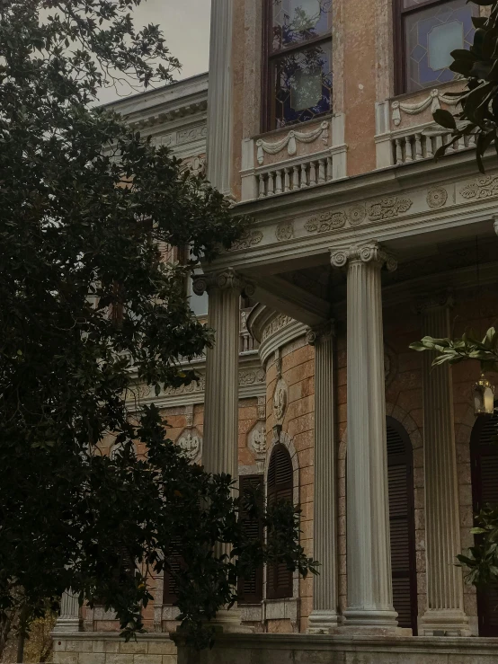 a statue that is sitting on some steps in front of a house