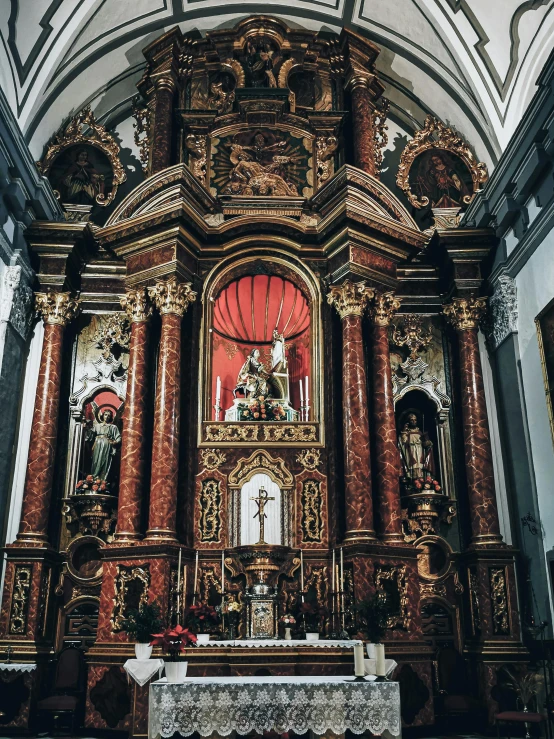 the alter of a building with ornate columns