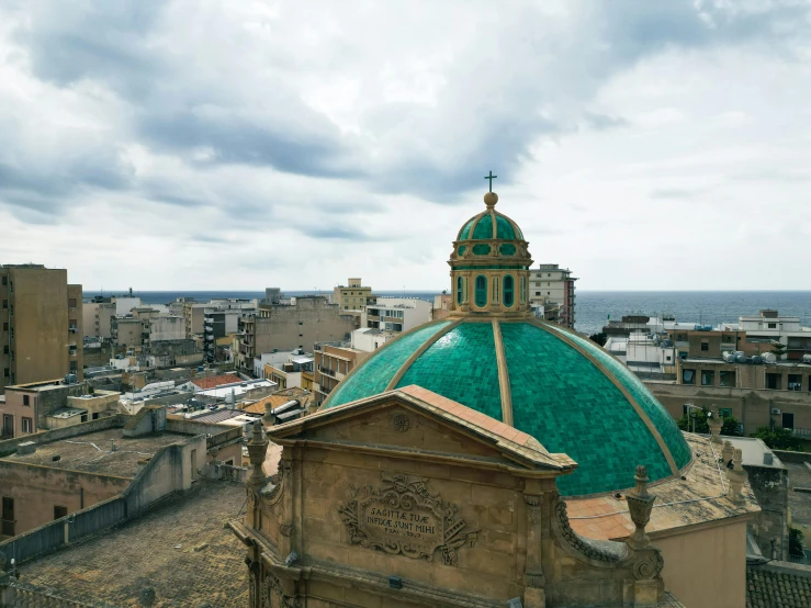 a domed building has a clock on top