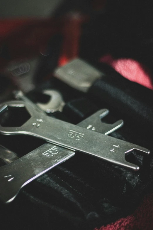 two scissors sit on a case and have some of them opened