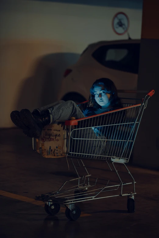 a small child sitting inside a shopping cart