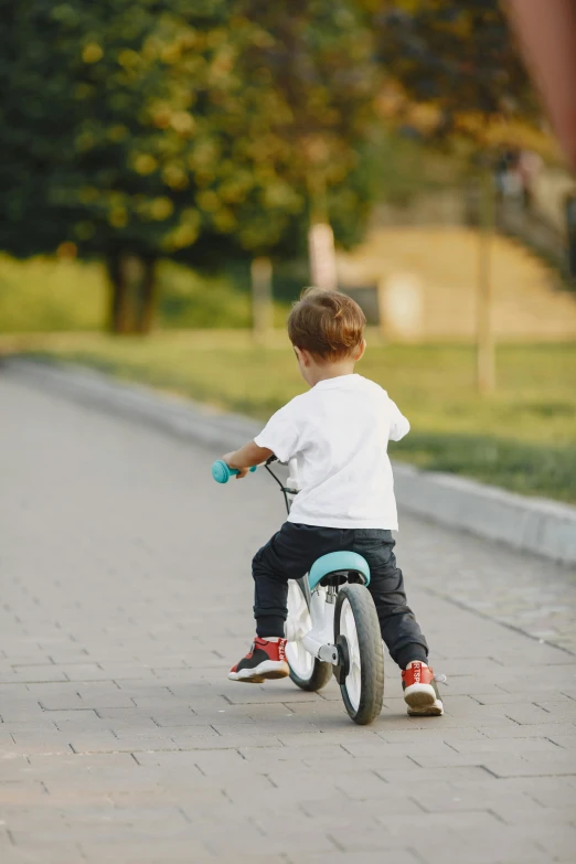 a  riding on a little tricycle