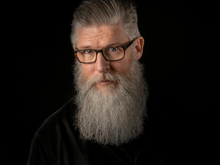 an old man with a large beard and glasses