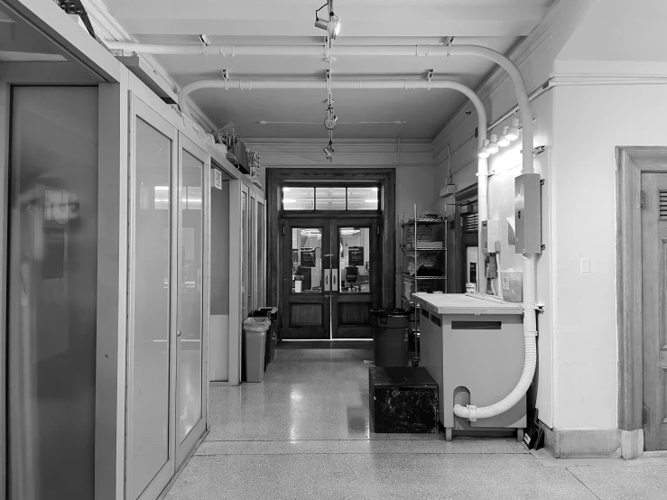 a large hall with glass door and a blow dryer