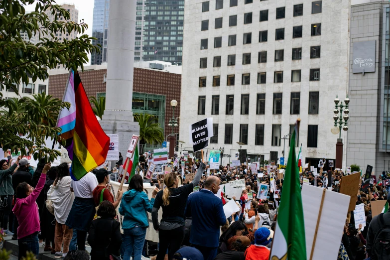 an image of people marching down the street with flags