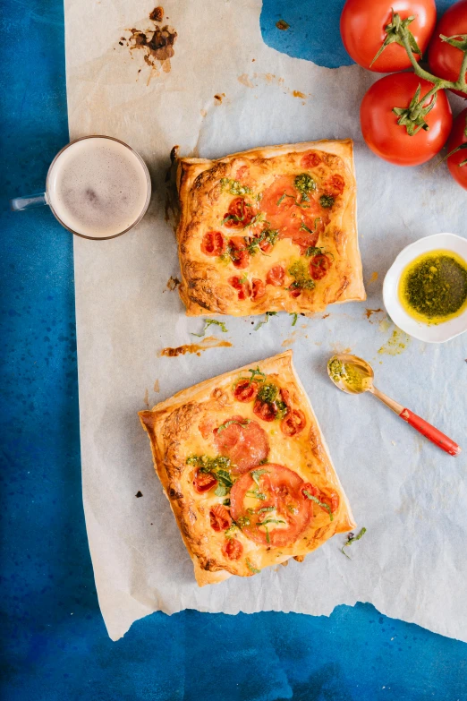 two different kinds of pizza on parchment paper