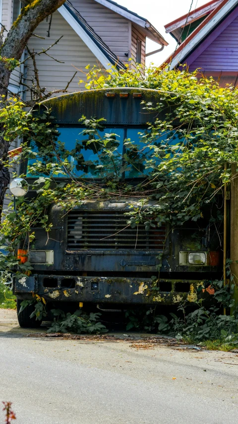 an abandoned bus sitting out in the country