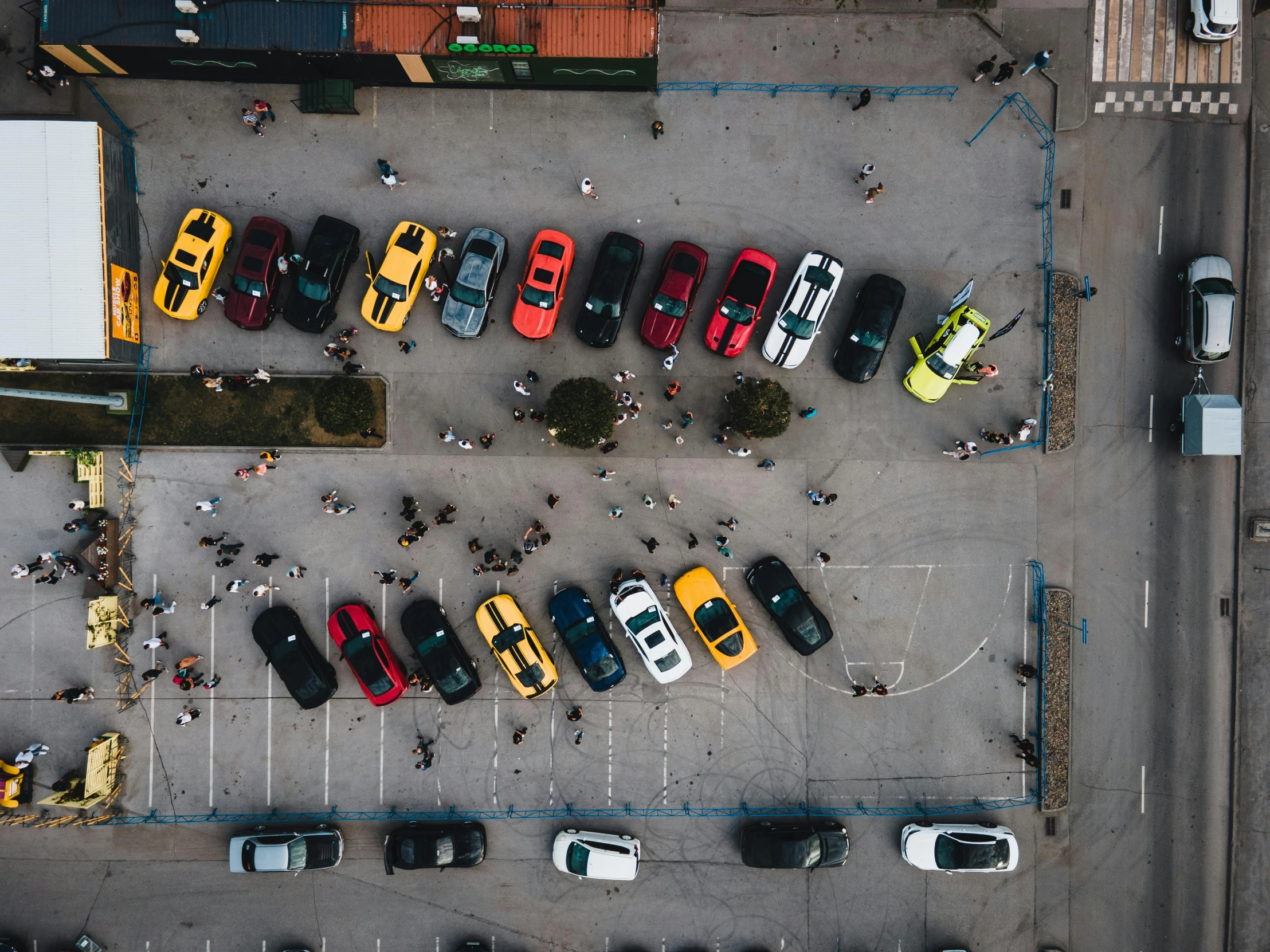 a parking lot filled with lots of different types of cars