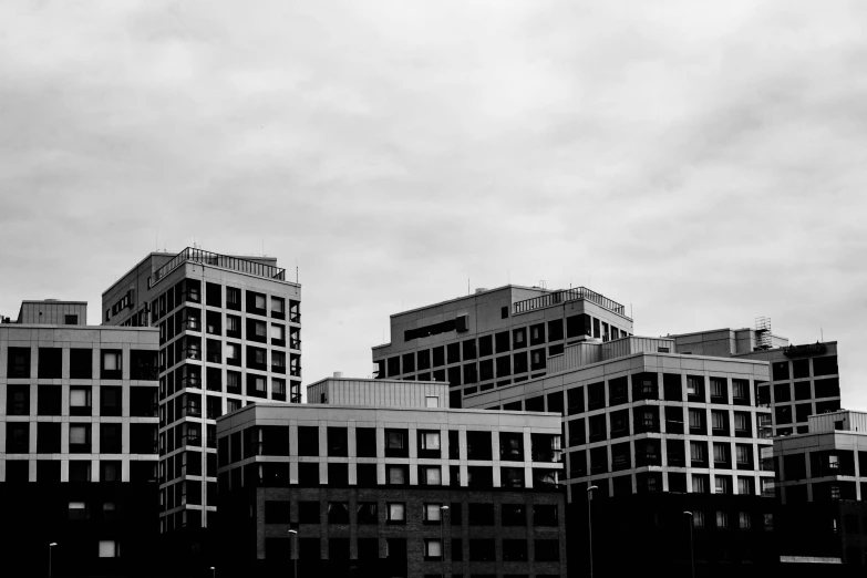 an airplane is flying over buildings in the sky