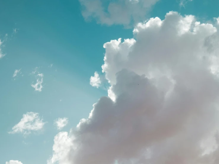 the clouds are flying through the blue sky