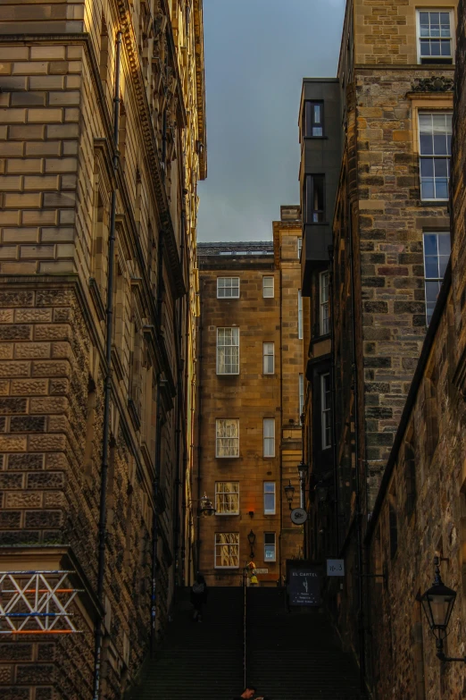 a city street filled with tall brick buildings