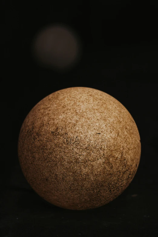 a large brown orange sitting on top of a table