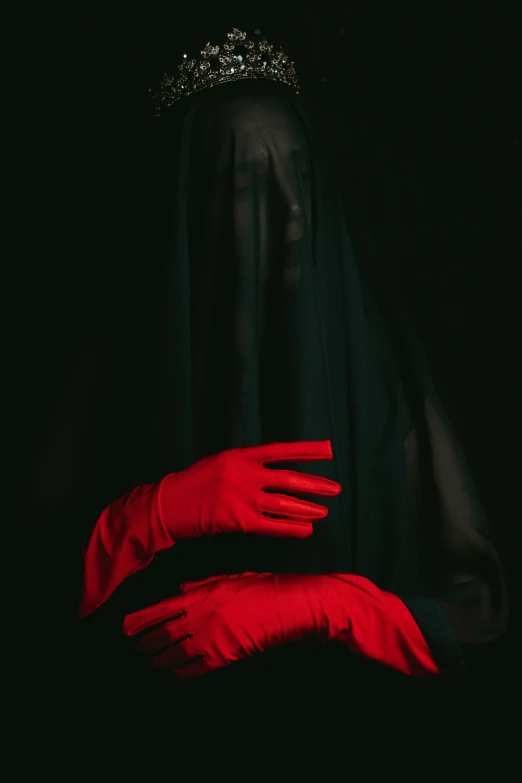 the red gloves are in a dark room