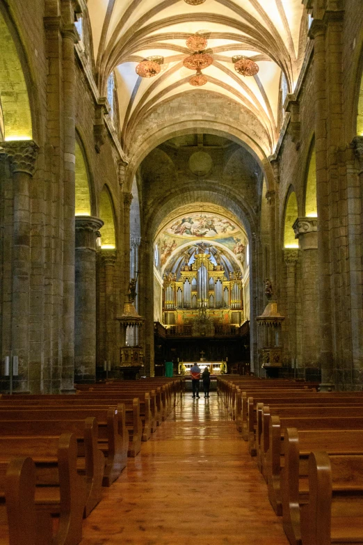 the inside of a church with lots of pews