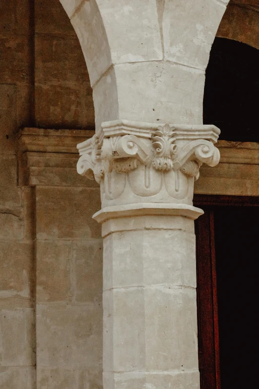 two different architectural pieces are on display at the entrance of a building