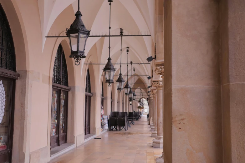 an arcade with a view of stained glass windows