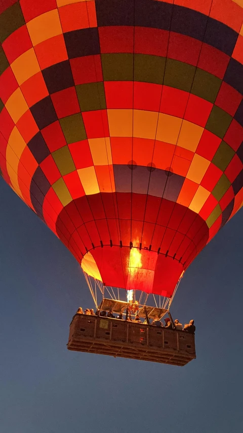 the  air balloon is flying in the sky