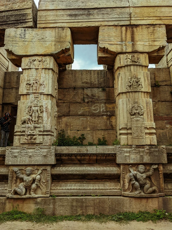 the ruins of an old temple with carved pillars