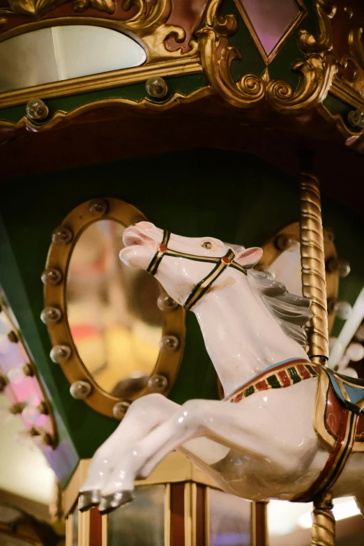 a carousel horse with a rider on it