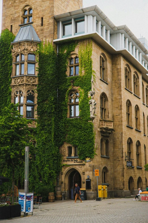 a brick building with vines growing over it