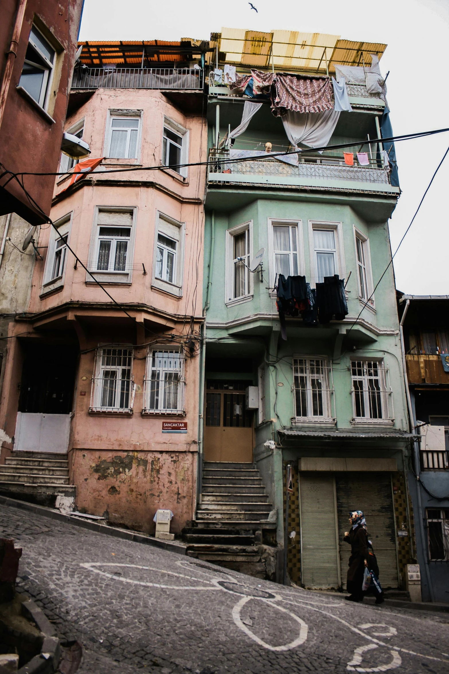 a city street with old buildings that are in color