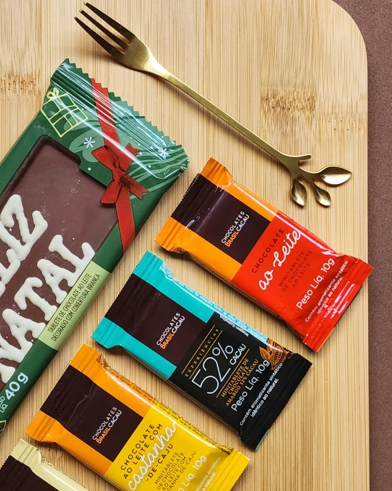 some food sitting on a wooden board next to a fork