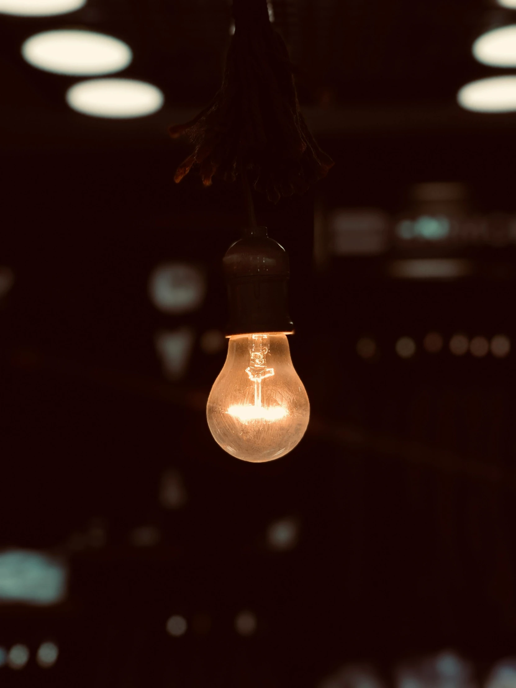 light bulb with the lighting on inside an open space