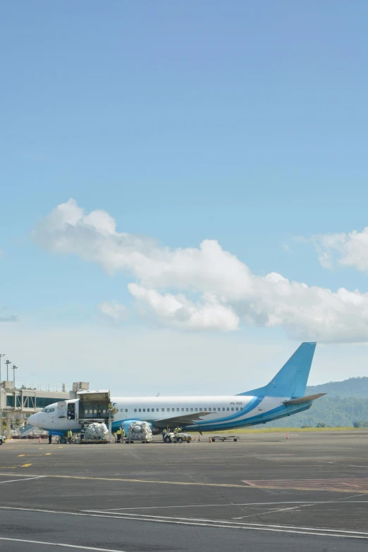 a jumbo jet sitting on top of an airport runway