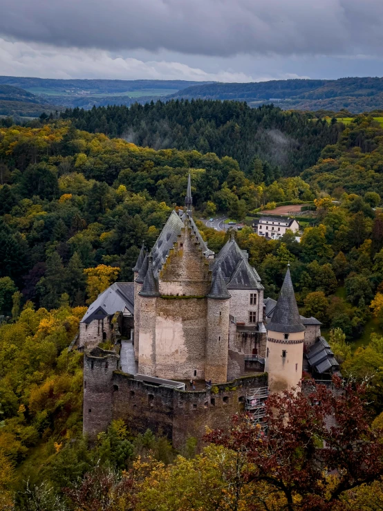 an aerial view of a building that has several spires