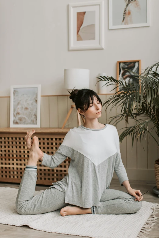 a person doing yoga in the living room