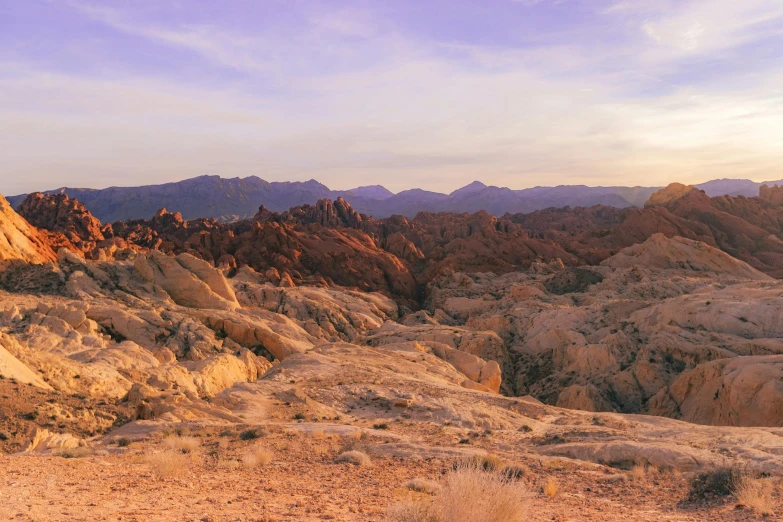 a view of mountains and valleys are seen from high up in the desert