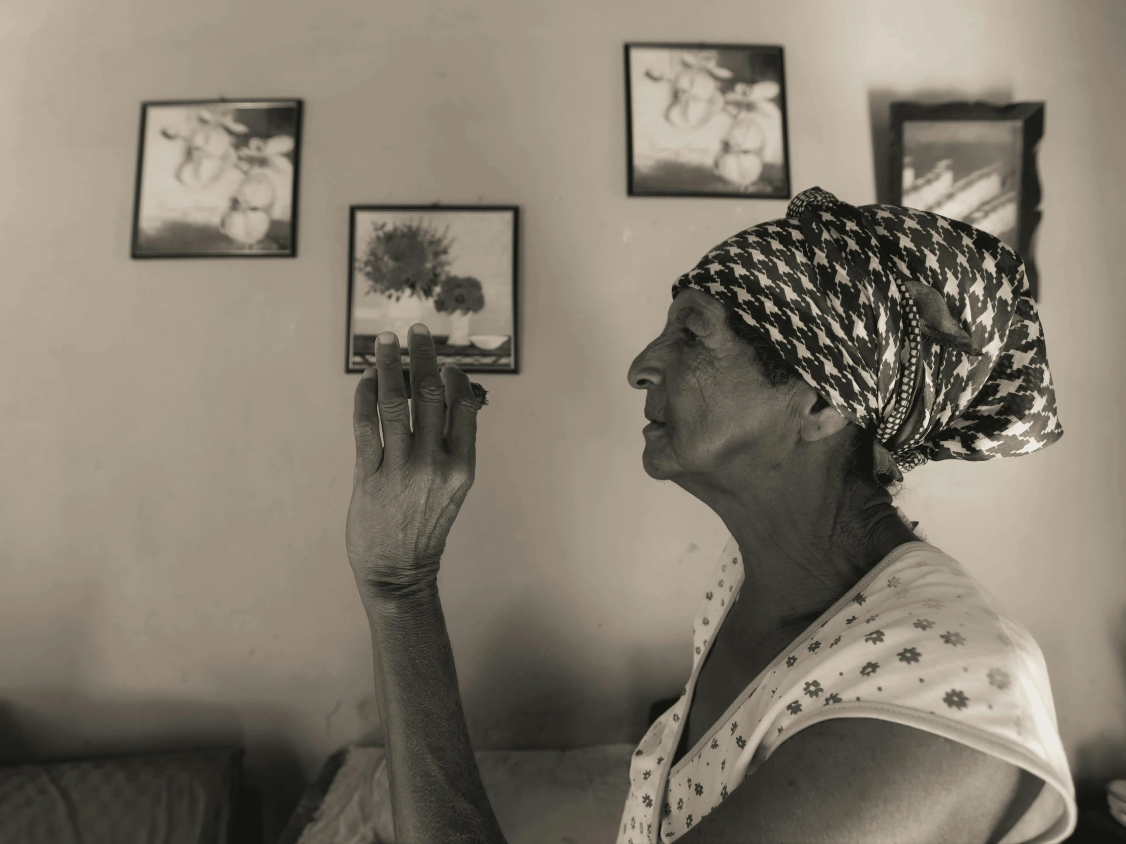 an older woman in a towel is holding a cell phone