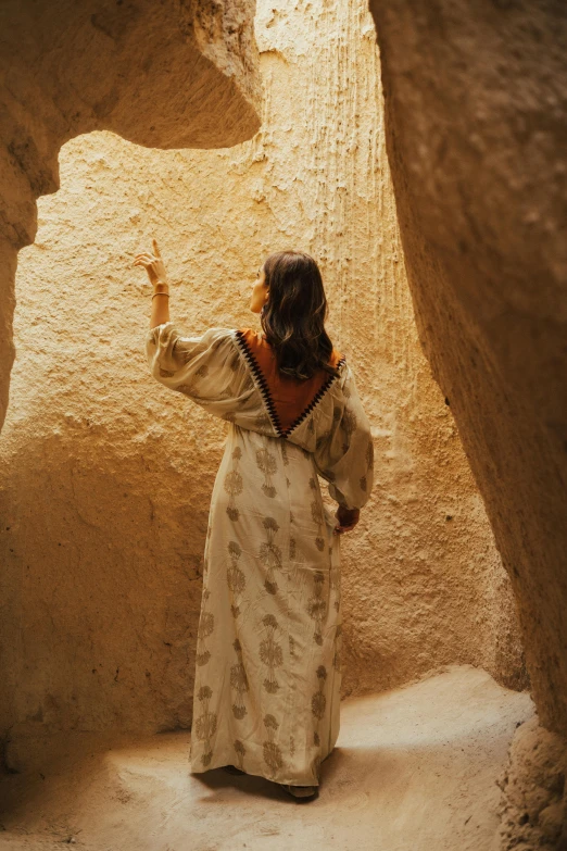 a person looking at soing in an area that has very many rocks