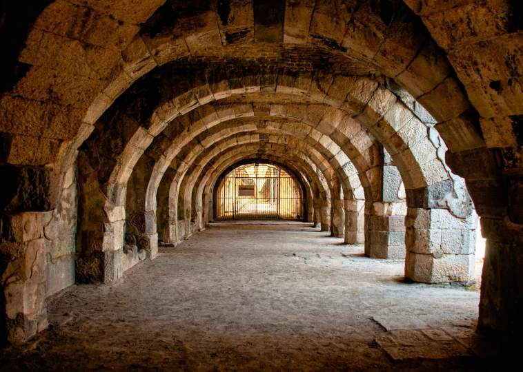 an old and stone walkway has been made into a tunnel