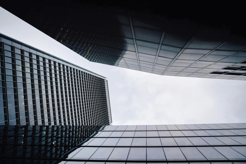 a group of tall buildings with glass balconies