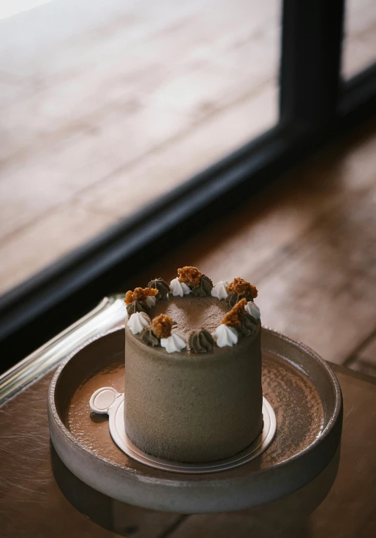 a cake on a wooden tray on a table