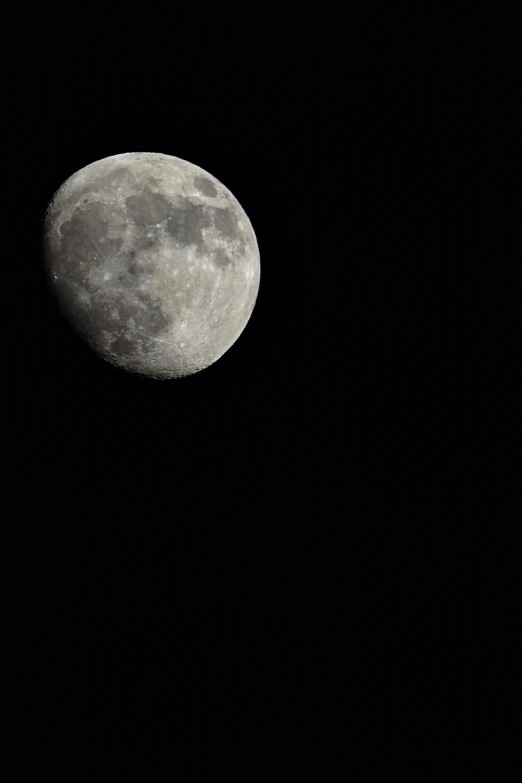 a full moon seen on dark skies with only one visible