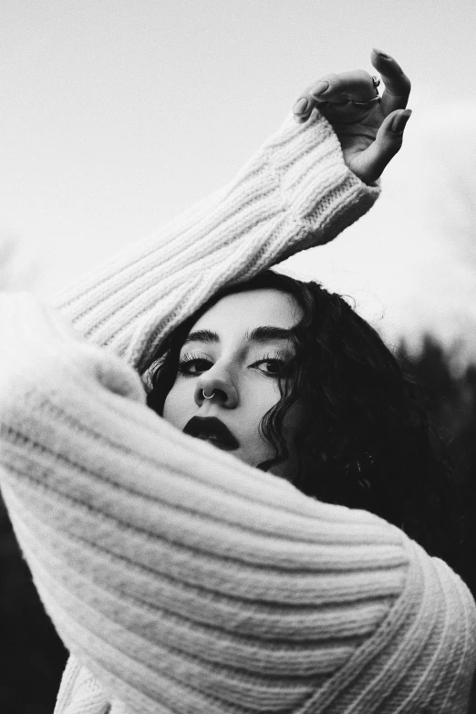 black and white po of a woman in a sweater