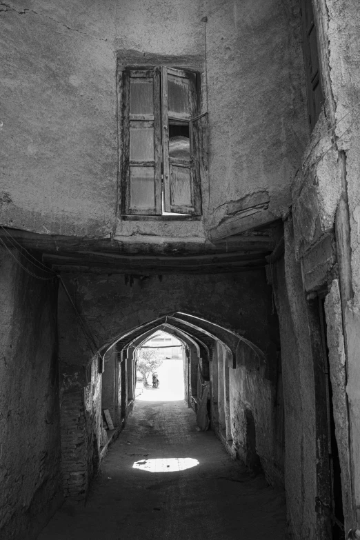 an old and narrow hallway in a building