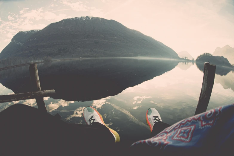 a pair of feet that are standing on a boat