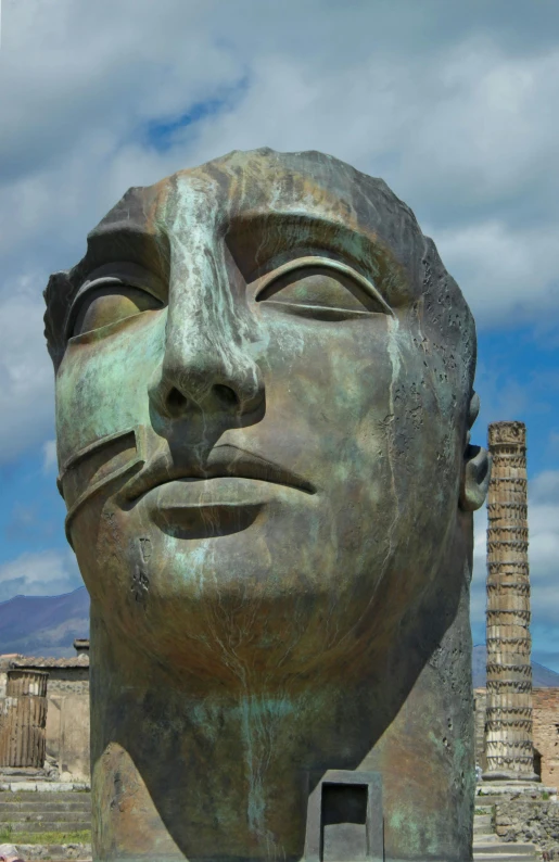 a sculpture sitting in front of a large building