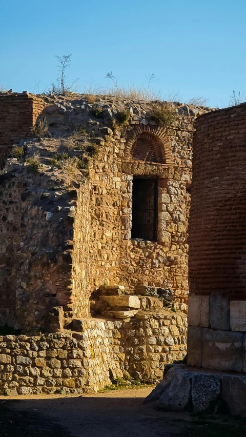 there is an old building with a small window and door