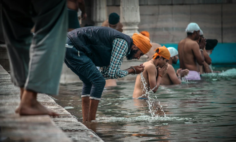 there are many people in the water at this public swimming spot