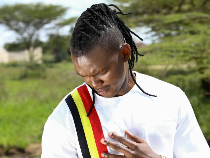 a woman in a white shirt with her hands folded